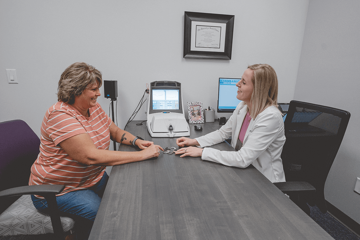 Dr Bennett with patient at desk